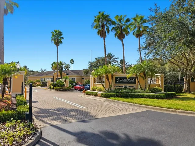 an aerial view of a house with a swimming pool a patio and yard
