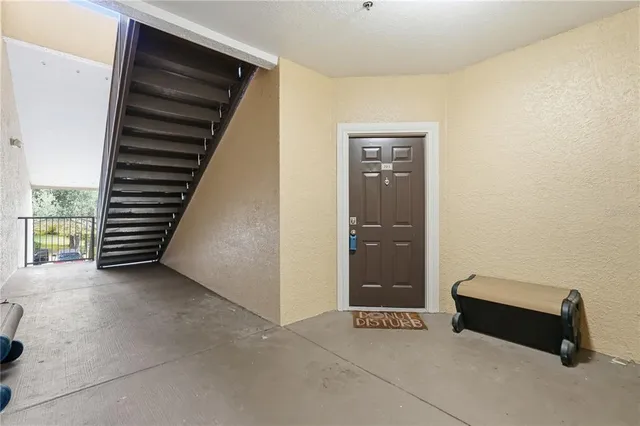 a view of kitchen with sink and wooden floor