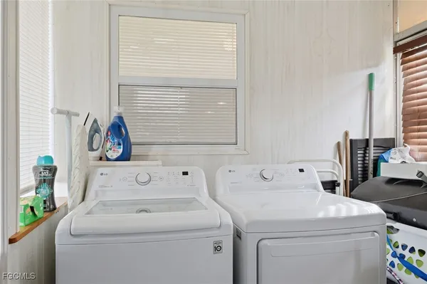 a utility room with dryer and washer