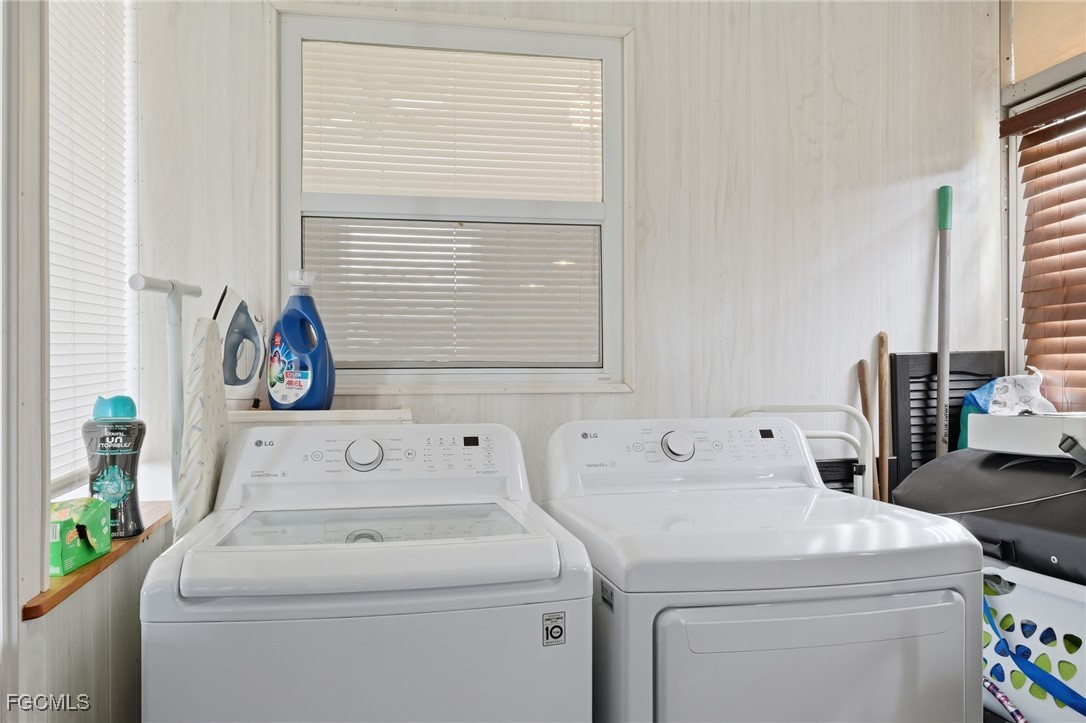 24 Cheyenne Trail, Unit 167 Naples, FL 34113 - Photo 27 of 27 a utility room with dryer and washer