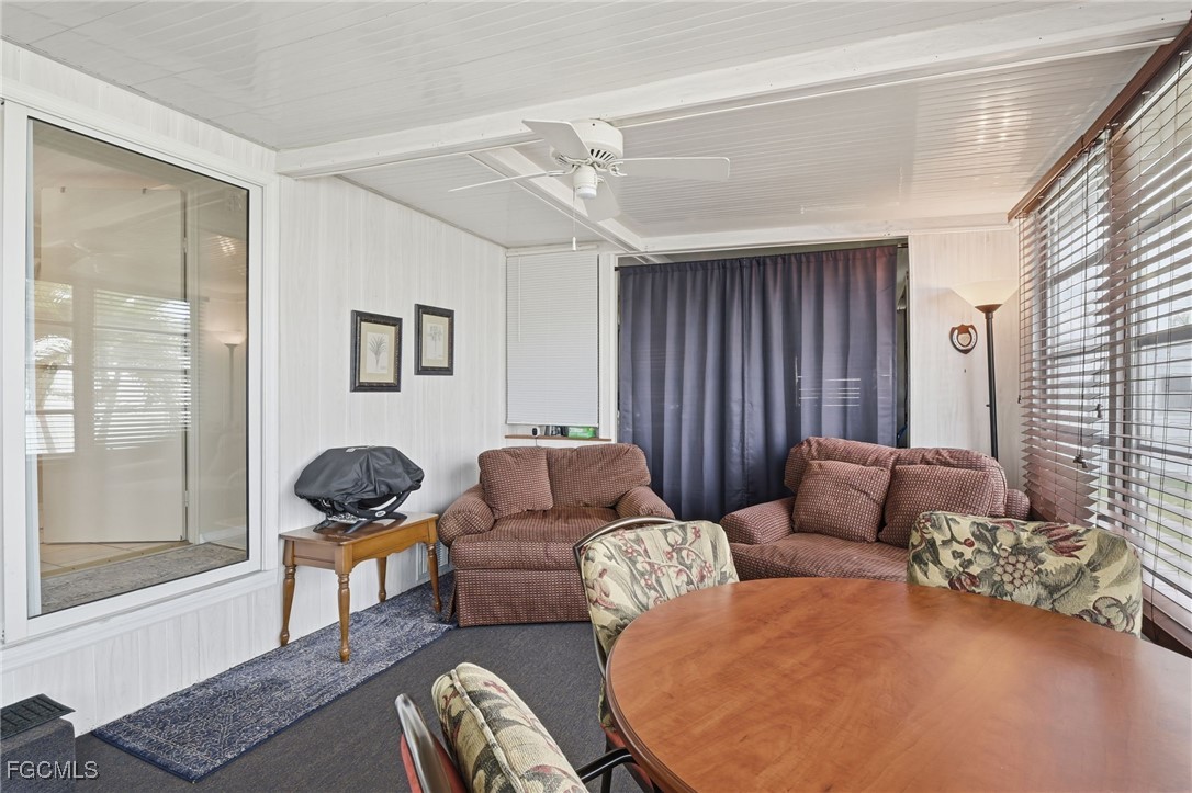 24 Cheyenne Trail, Unit 167 Naples, FL 34113 - Photo 4 of 27 a living room with furniture and a window