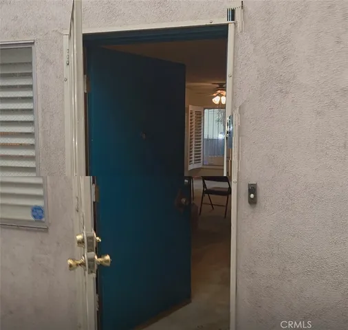 a kitchen with a sink a stove and a refrigerator