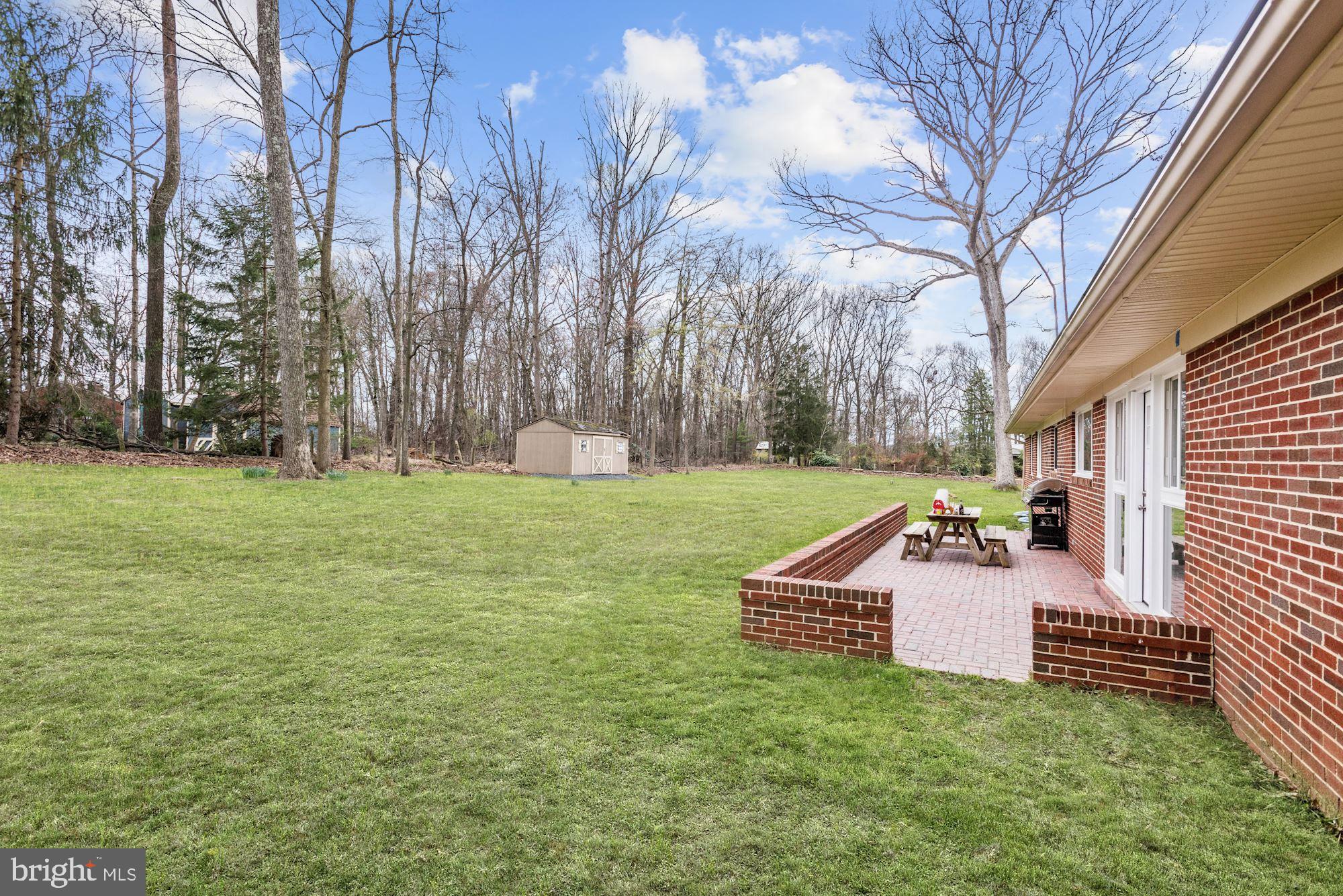 14545 Roxbury Road Glenelg, MD 21737 - Photo 25 of 34 Custom Brick Patio | Retractable Awning | Shed