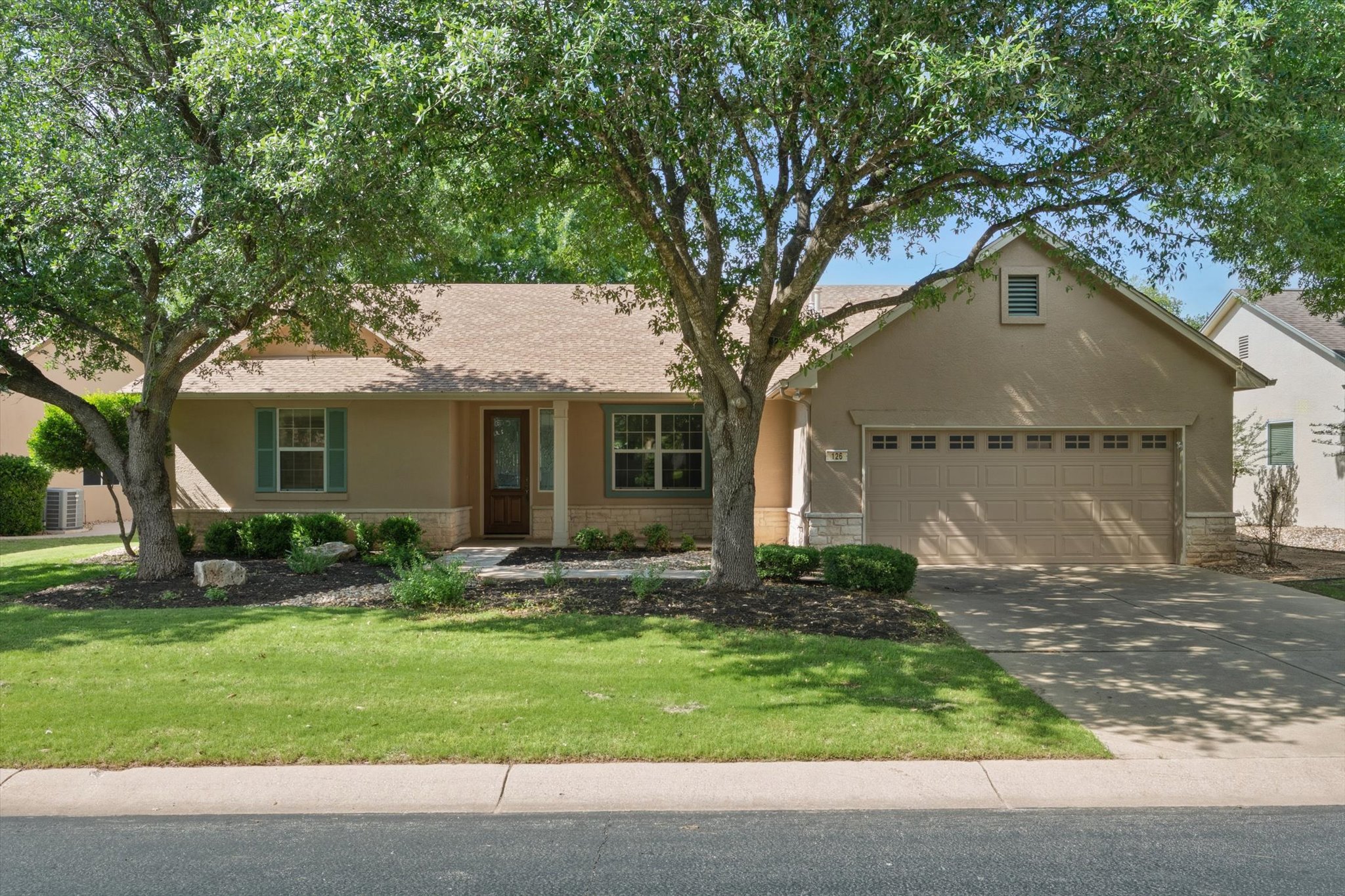126 Trail Rider Way Georgetown, TX 78633 - Photo 2 of 30 a front view of a house with garden