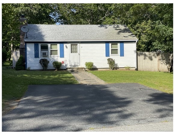 32 Lake Road Yarmouth, MA 02673 - Photo 1 of 17 a front view of a house with a yard