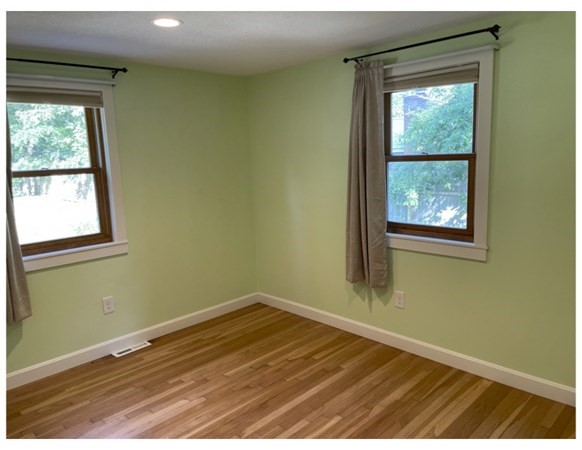 32 Lake Road Yarmouth, MA 02673 - Photo 13 of 17 an empty room with wooden floor and windows