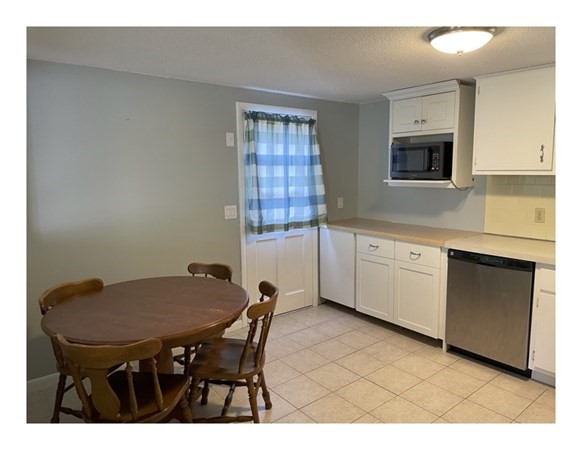 32 Lake Road Yarmouth, MA 02673 - Photo 6 of 17 a view of a dining room with furniture and window