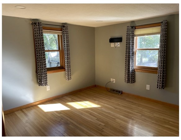 32 Lake Road Yarmouth, MA 02673 - Photo 10 of 17 an empty room with wooden floor and windows