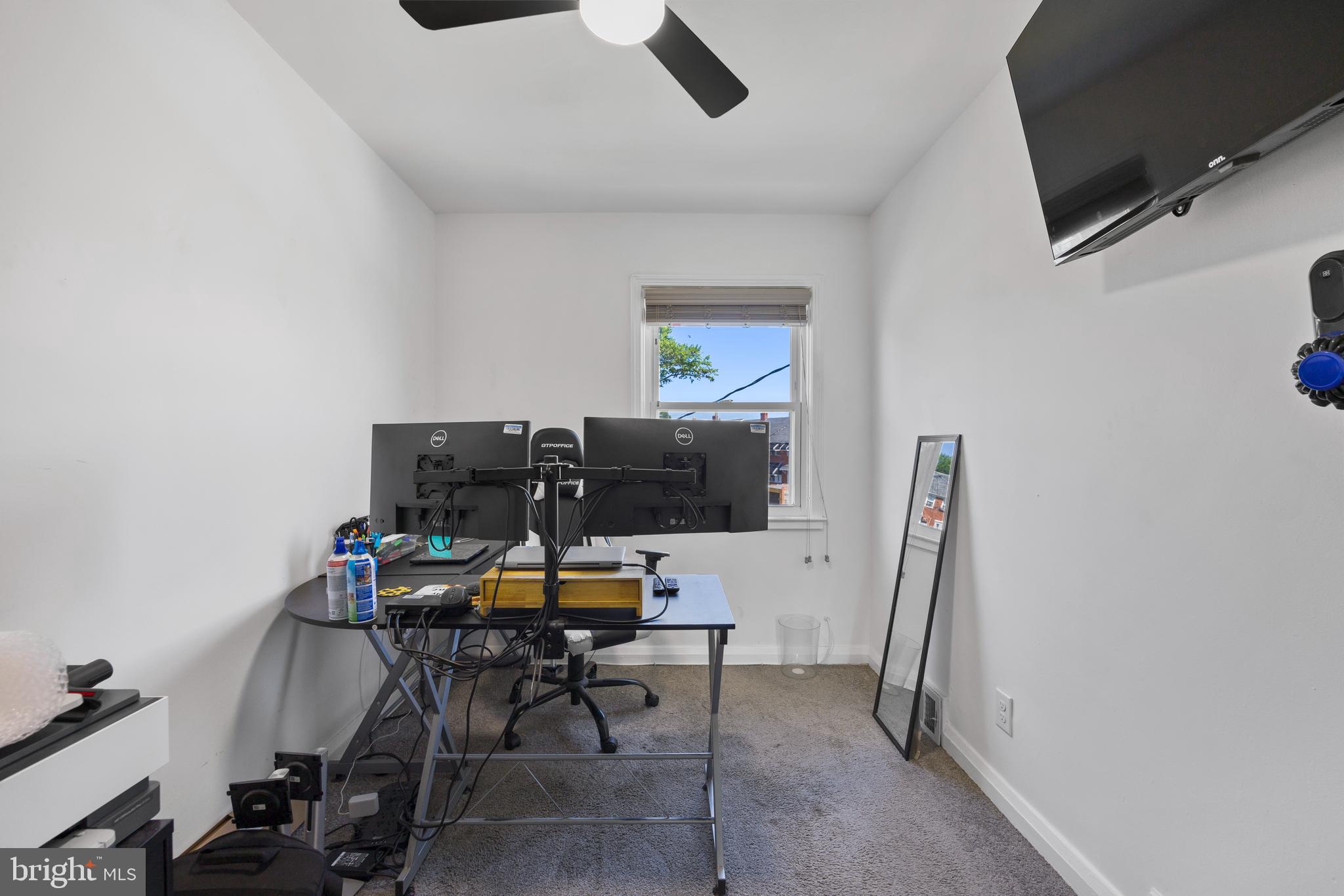 4511 Marble Hall Road Baltimore, MD 21239 - Photo 30 of 48 a view of a workspace with furniture and a window