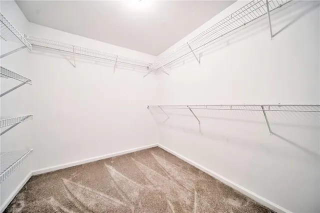 a bathroom with a sink vanity mirror and toilet
