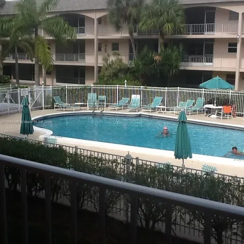 a view of swimming pool from a balcony