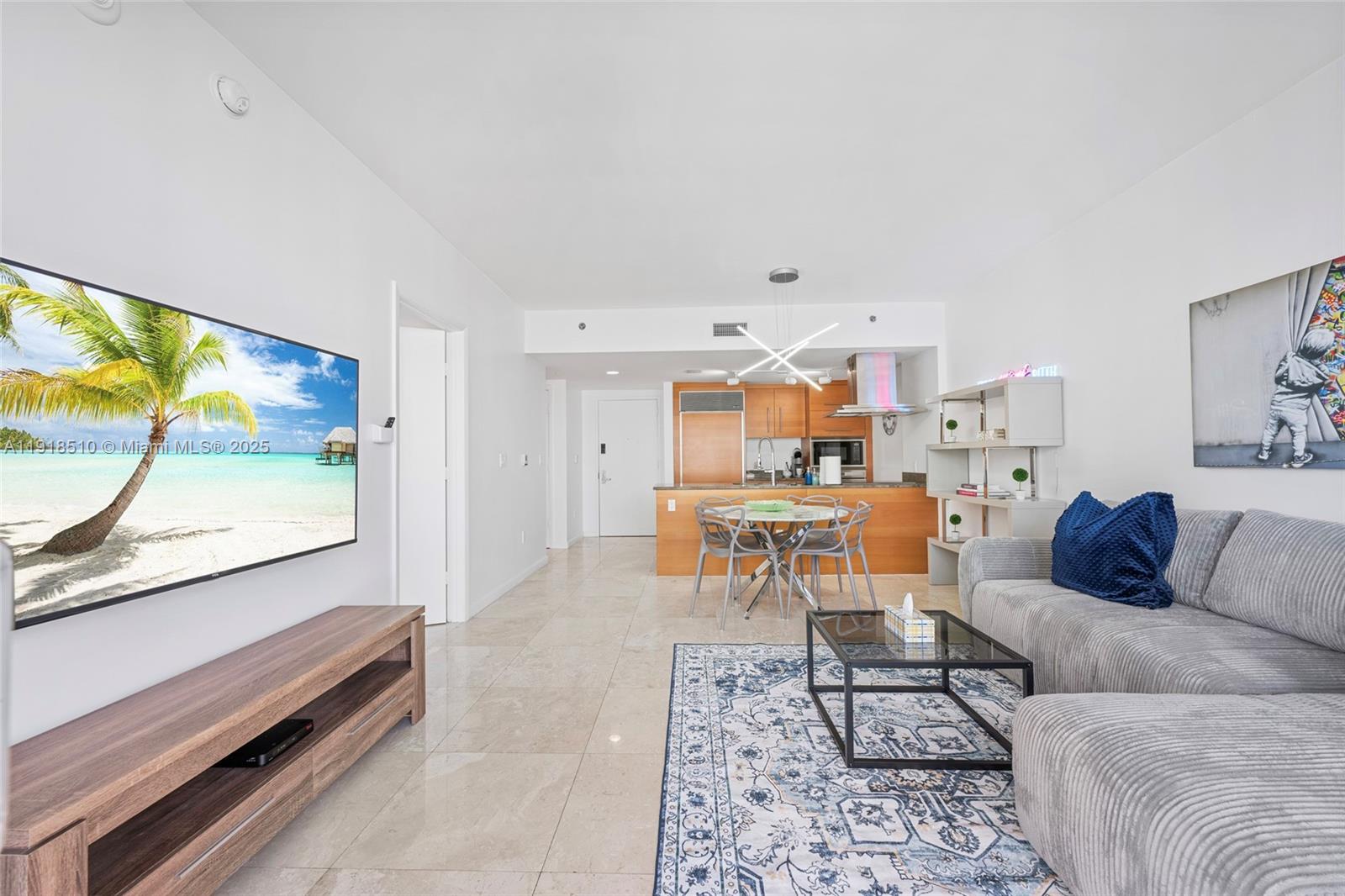 485 Brickell Avenue, Unit 3503 Miami, FL 33131 - Photo 11 of 23 a living room with furniture and a flat screen tv