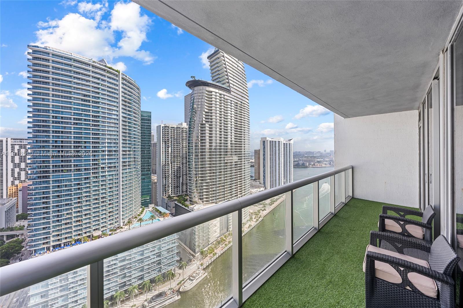 485 Brickell Avenue, Unit 3503 Miami, FL 33131 - Photo 13 of 23 a view of a balcony with wooden floor and outdoor space