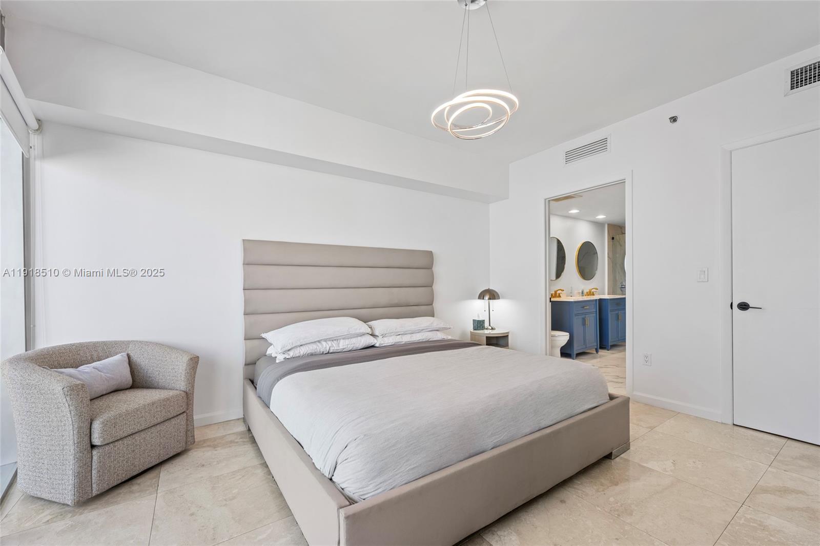 485 Brickell Avenue, Unit 3503 Miami, FL 33131 - Photo 17 of 23 a bedroom with a bed and a couch