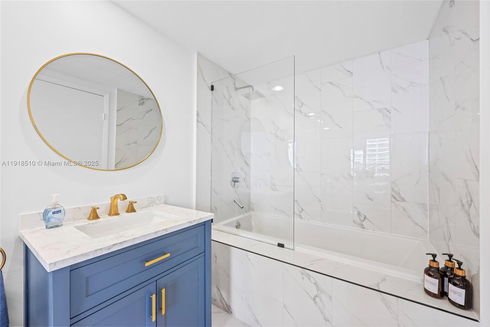 485 Brickell Avenue, Unit 3503 Miami, FL 33131 - Photo 20 of 23 a bathroom with a sink toilet and a mirror