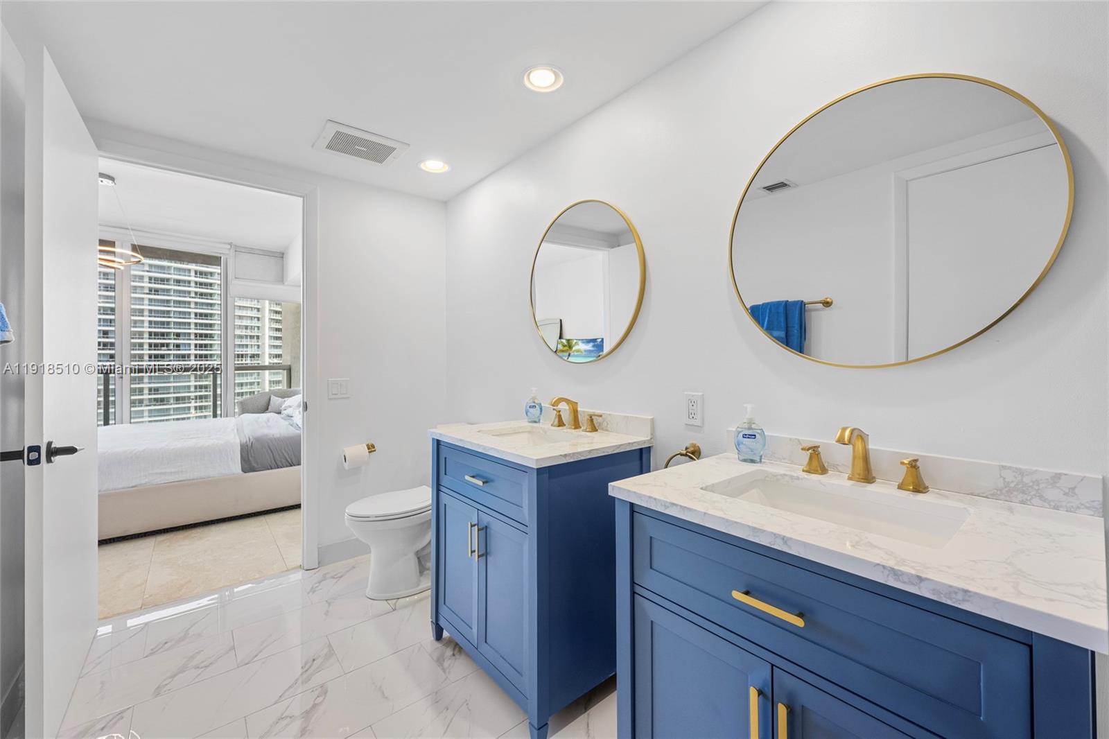 485 Brickell Avenue, Unit 3503 Miami, FL 33131 - Photo 21 of 23 a bathroom with a sink and a mirror