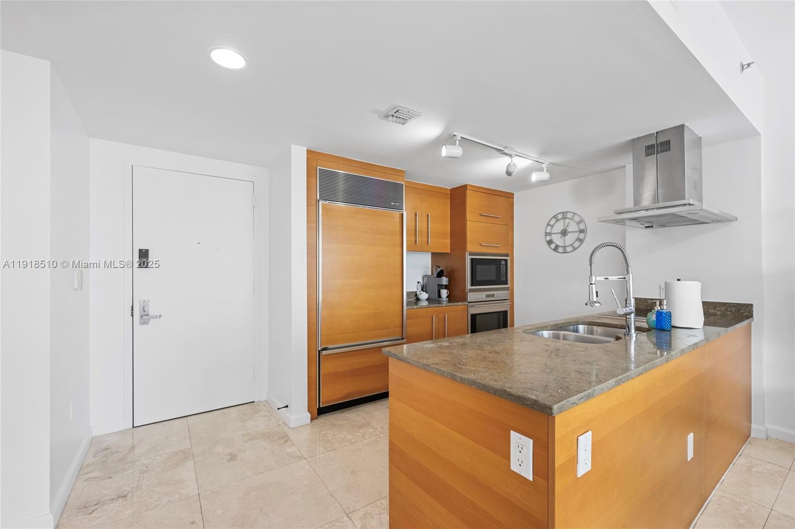 485 Brickell Avenue, Unit 3503 Miami, FL 33131 - Photo 4 of 23 a kitchen with stainless steel appliances granite countertop a sink a stove and a refrigerator
