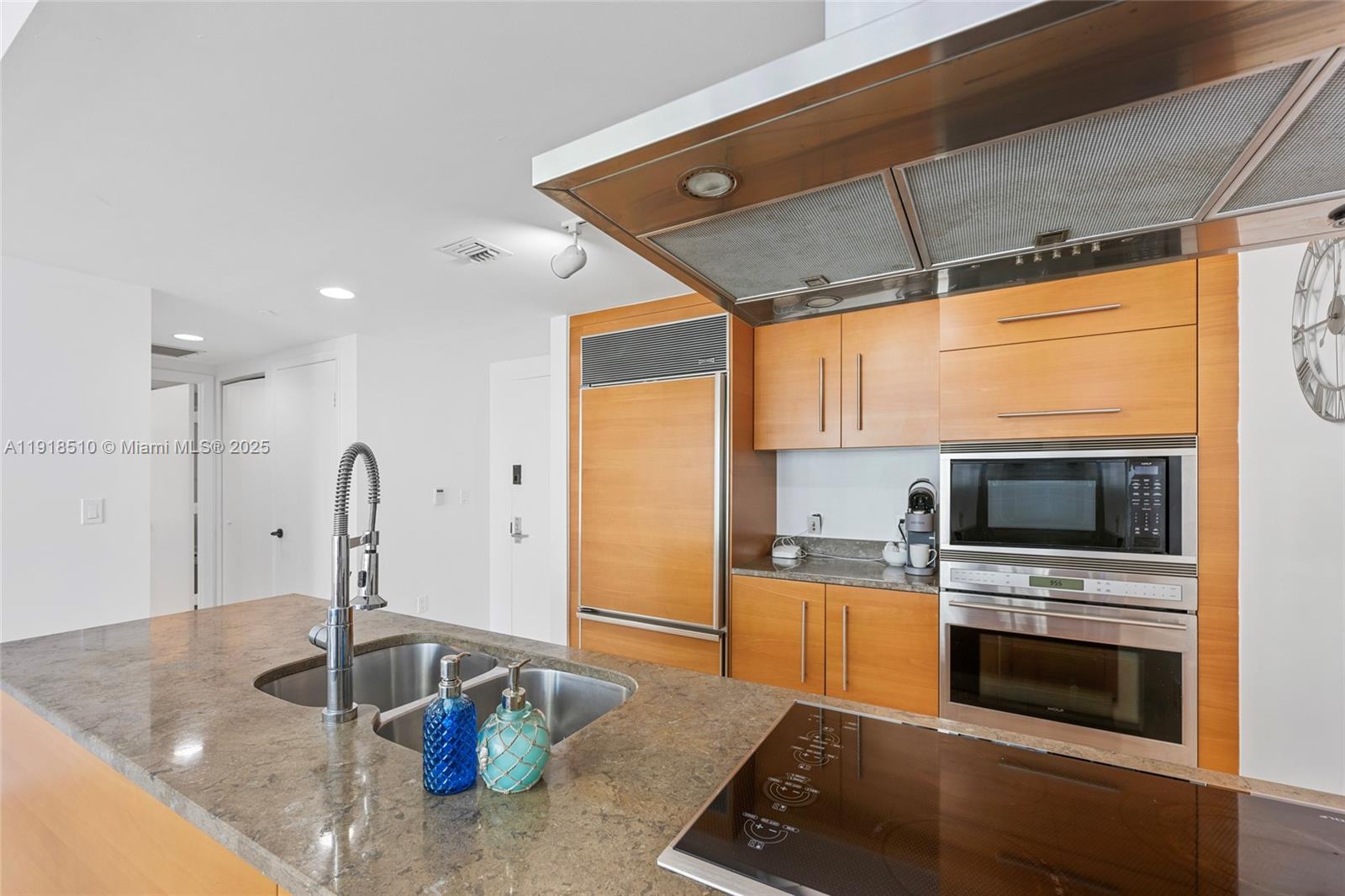 485 Brickell Avenue, Unit 3503 Miami, FL 33131 - Photo 5 of 23 a kitchen with stainless steel appliances granite countertop a sink and a stove