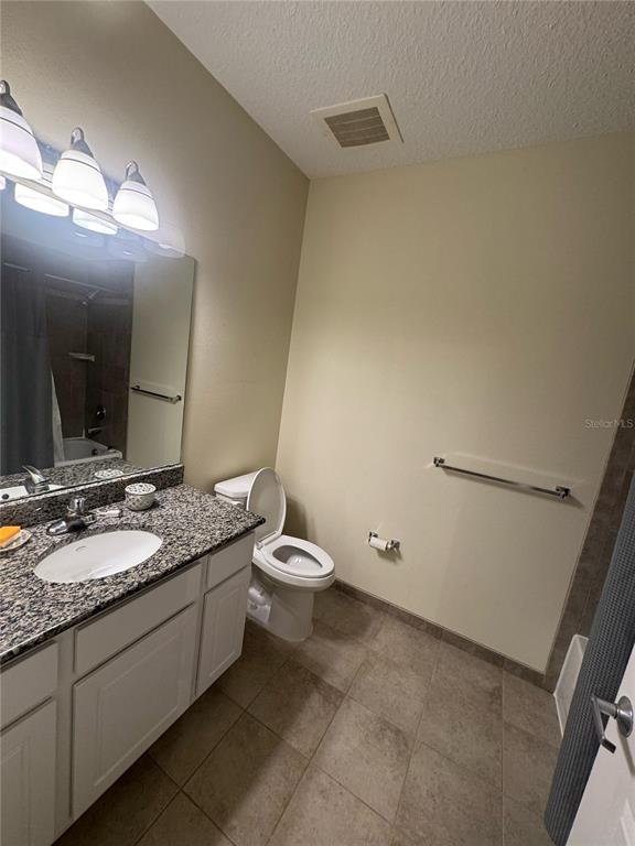300 State Street East, Unit 206 Oldsmar, FL 34677 - Photo 16 of 23 a bathroom with a granite countertop sink and a mirror