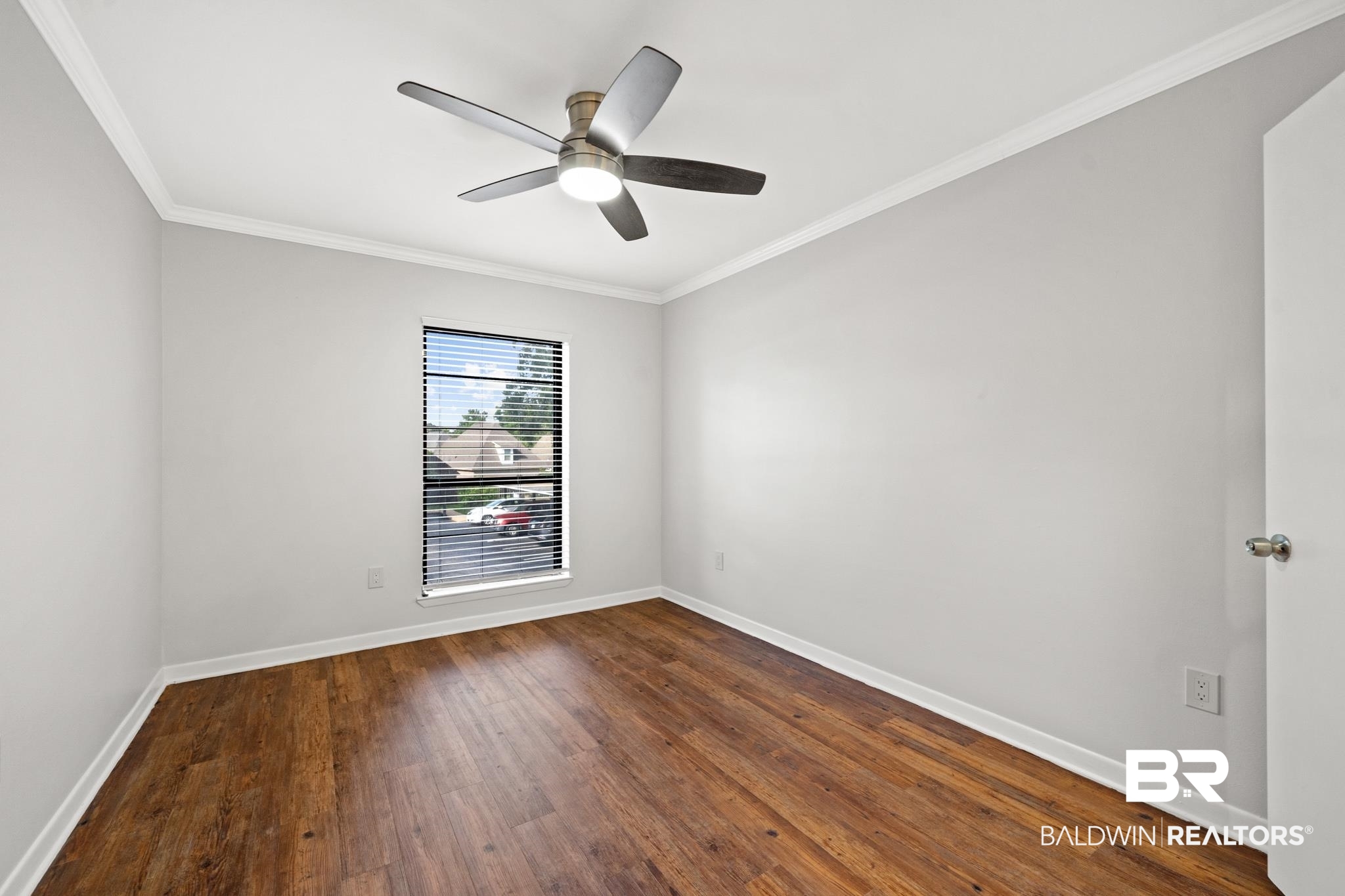 2901 Grant Street, Unit 802 Mobile, AL 36606 - Photo 25 of 37 Empty room with ornamental molding, hardwood / wood-style flooring, and ceiling fan