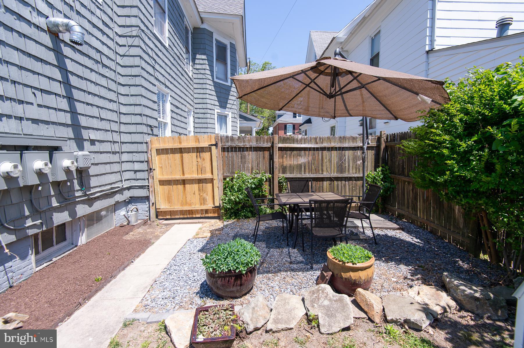 606 Locust Street Cambridge, MD 21613 - Photo 34 of 37 a view of a chair and table in backyard