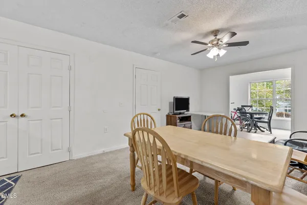 a view of a dining room with furniture