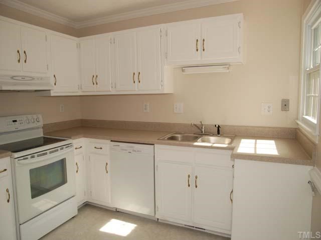 7512 Mine Shaft Road Raleigh, NC 27615 - Photo 3 of 12 a kitchen with cabinets appliances and sink