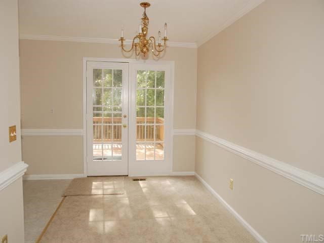 7512 Mine Shaft Road Raleigh, NC 27615 - Photo 4 of 12 a view of an empty room with a window