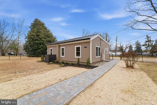 a view of a house with a snow on the road
