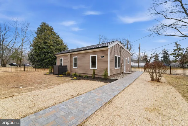 a view of a house with a snow on the road