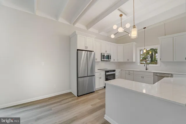 a view of an empty room with glass door