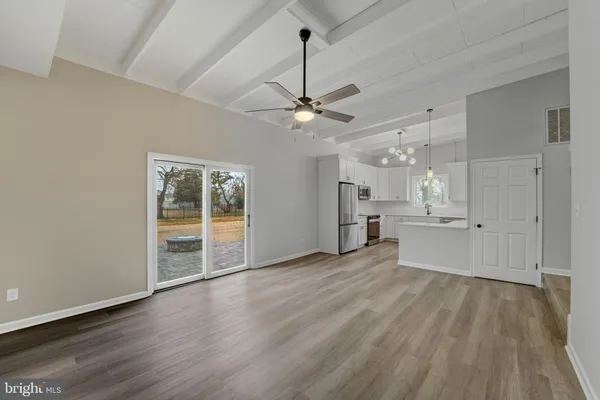 a view of an empty room with glass door