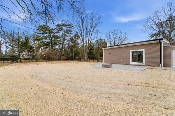 a view of house with snow on yard