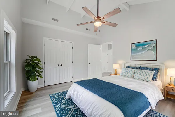 a bedroom with furniture and a chandelier