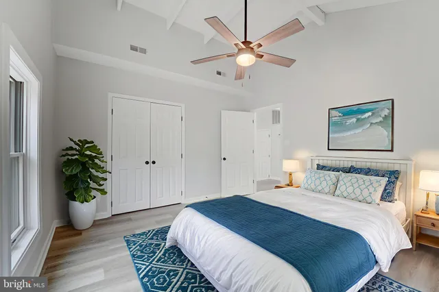 a bedroom with furniture and a chandelier