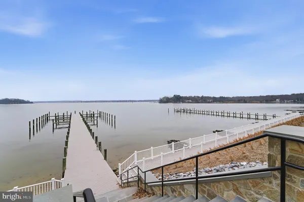 a view of a lake with houses in the back