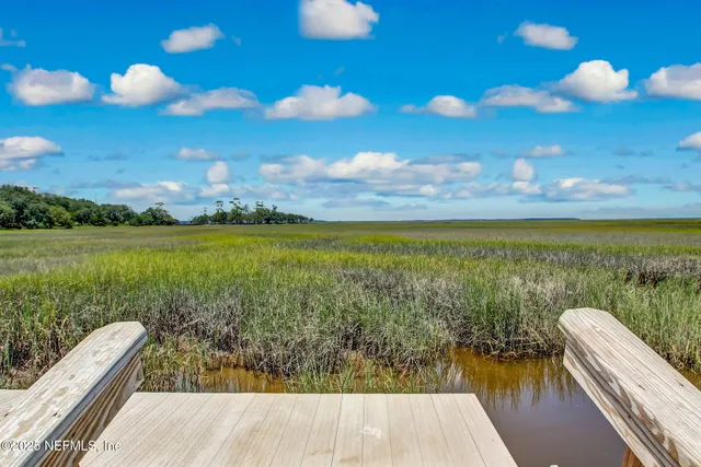 a view of a pathway with a lake view