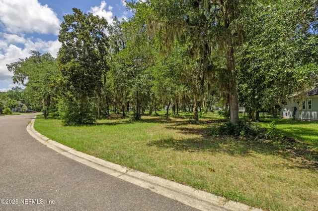 a view of a tree in front of a house