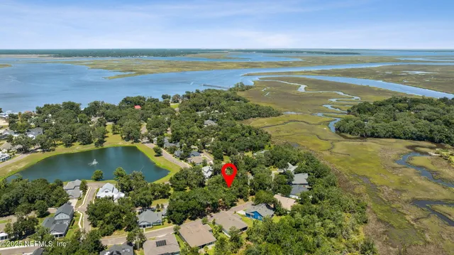 a view of a street with a building and a street sign