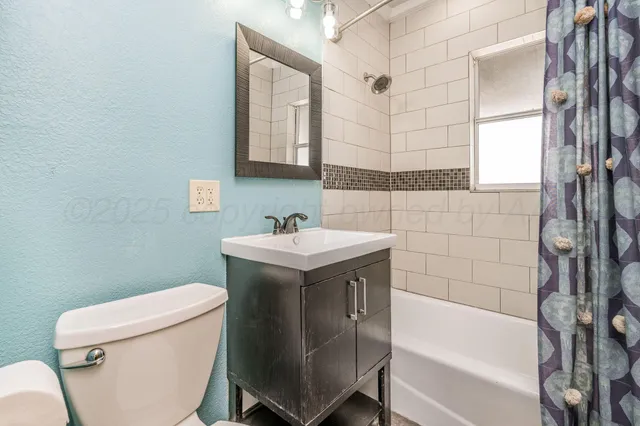 a bathroom with a sink a toilet and bathtub