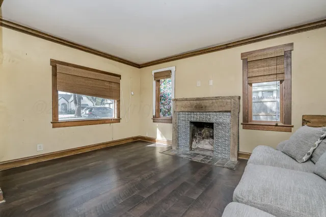 a living room with furniture and a fireplace