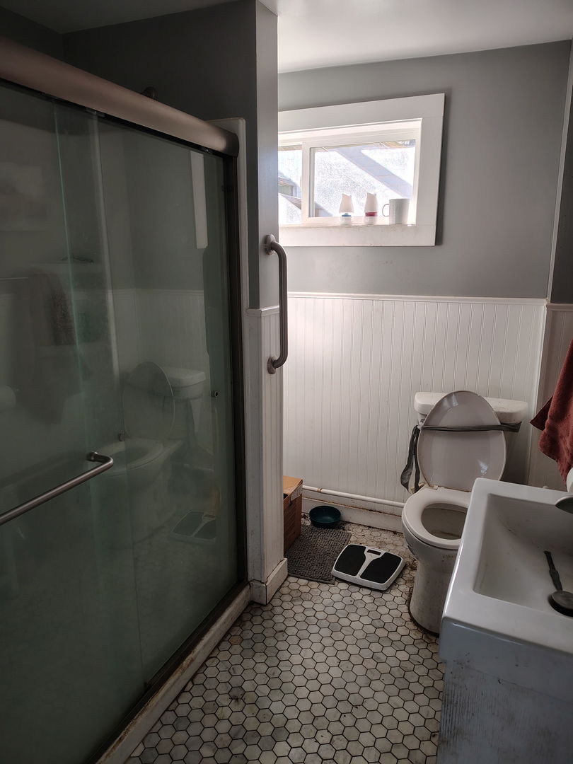 335 6th Avenue North Clinton, IA 52732 - Photo 9 of 23 a bathroom with a sink and a mirror