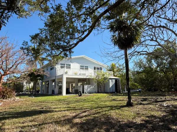 a house with river in front of it