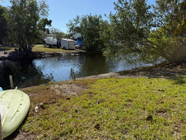a view of house with yard