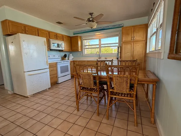 a living room with furniture and a book shelf