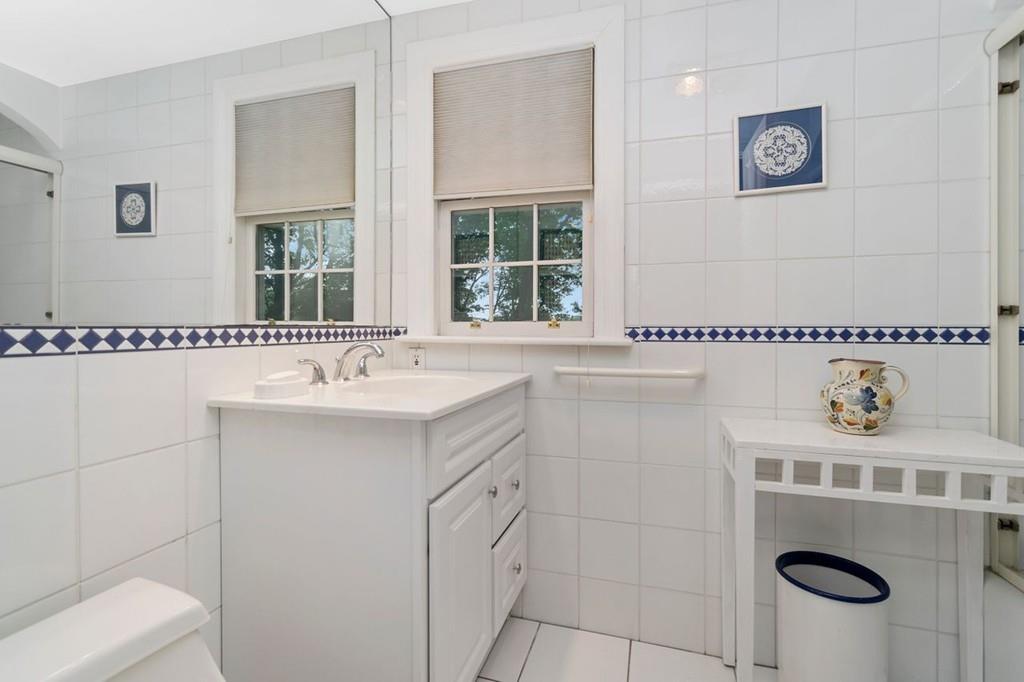 142 Kirkstall Road Newton, MA 02460 - Photo 12 of 23 a bathroom with a sink and a window