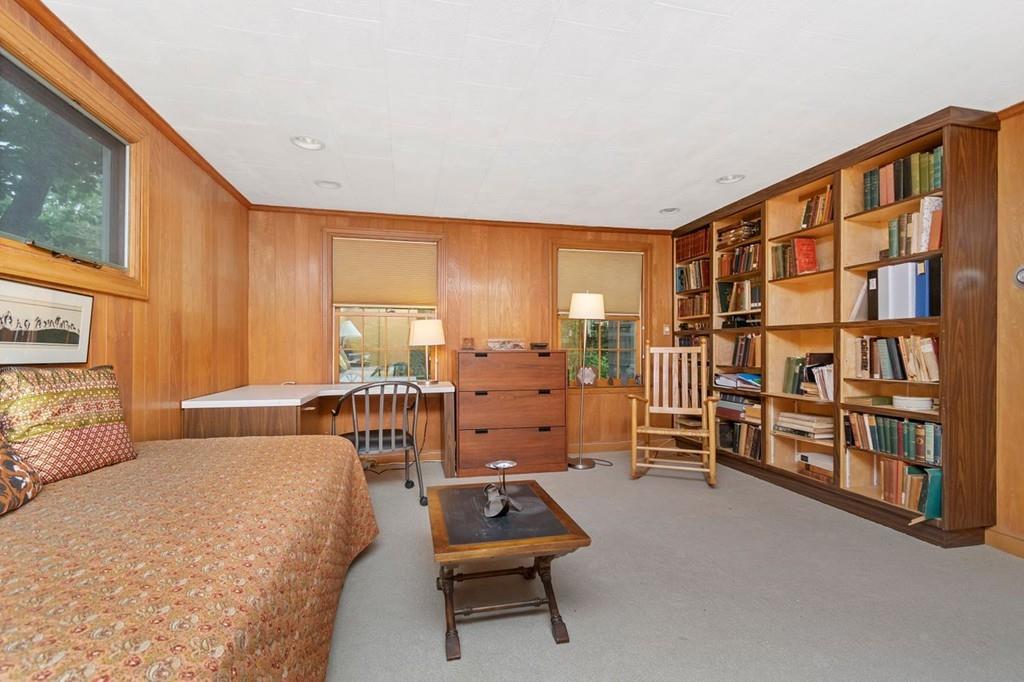 142 Kirkstall Road Newton, MA 02460 - Photo 13 of 23 a bedroom with furniture and a book shelf