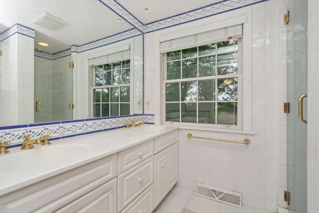 142 Kirkstall Road Newton, MA 02460 - Photo 17 of 23 a bathroom with a sink and a window