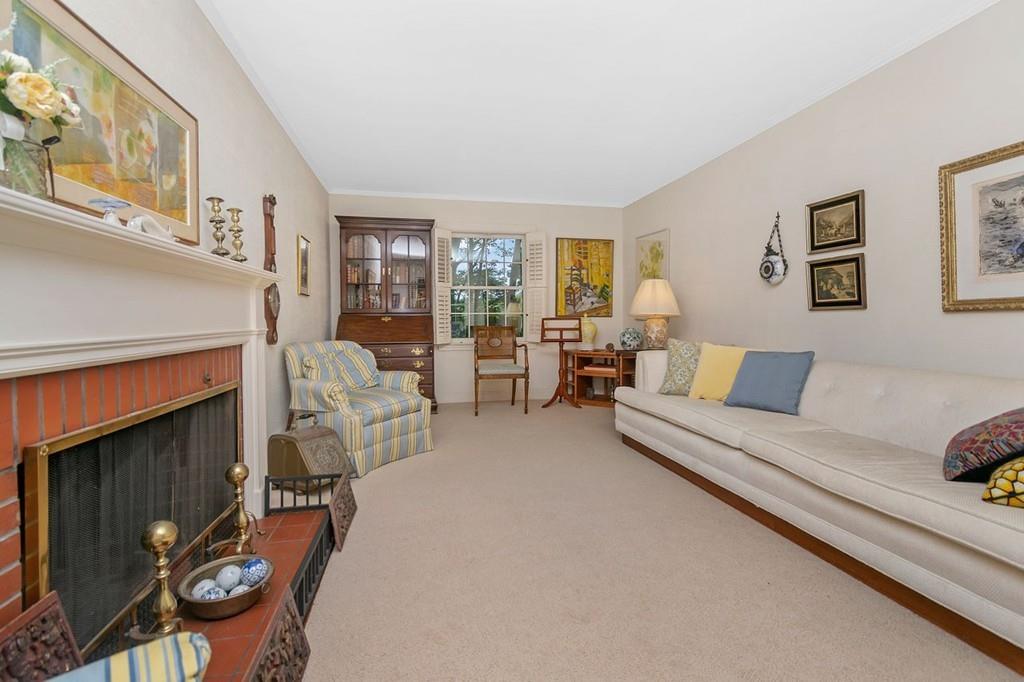 142 Kirkstall Road Newton, MA 02460 - Photo 3 of 23 a living room with furniture and a fireplace