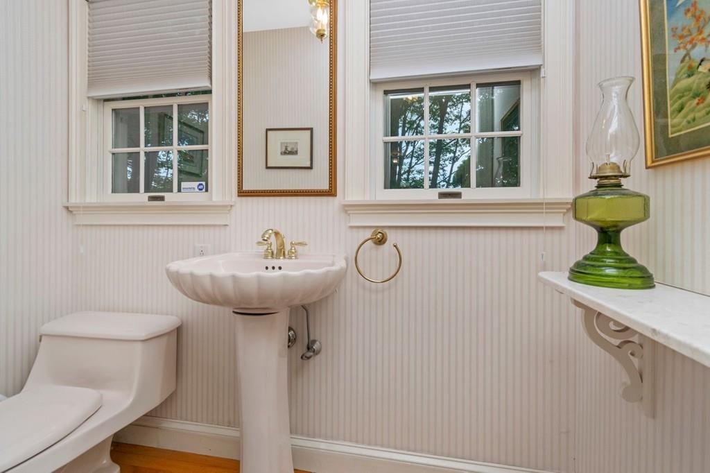 142 Kirkstall Road Newton, MA 02460 - Photo 5 of 23 a bathroom with a sink a toilet and a mirror